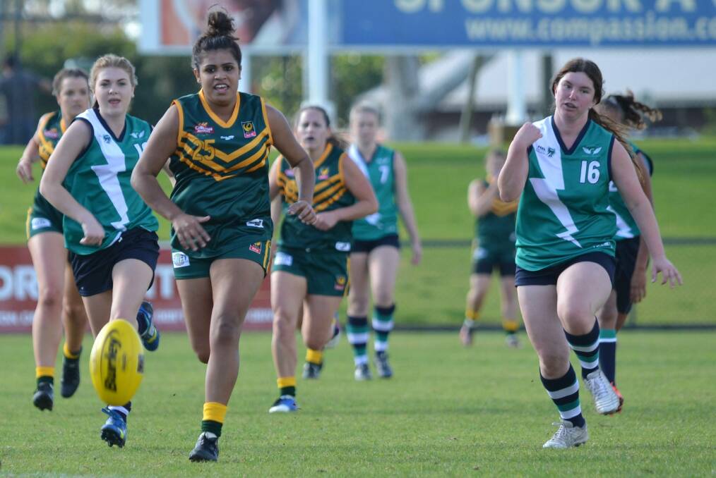Foot race: South West player Shontai Farrant sprints for the ball with Peel's Tamika Webb in hot pursuit. Photo: Andrew Elstermann.