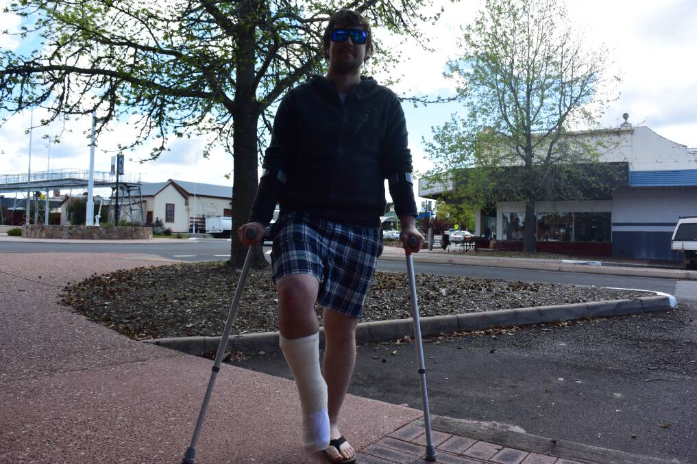 Injury: Collie resident Tyler Giles has right foot sliced open by glass while wading in Sandy Beach earlier this month. Photo: Thomas Munday. 