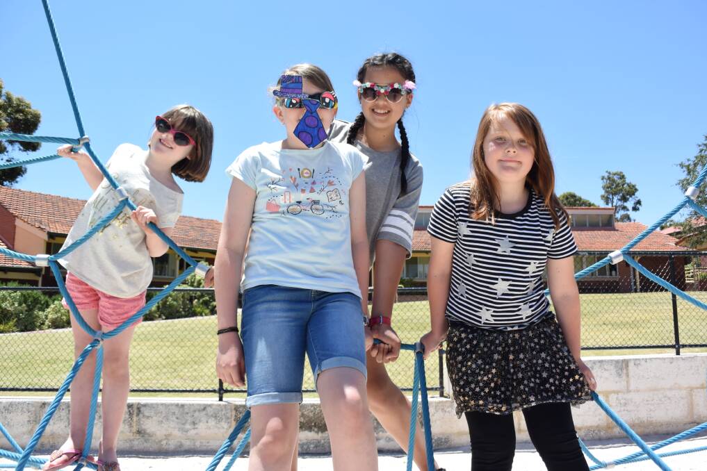 Time together: Georgina, Jamelia, Lauren and Saraya enjoyed a sunny day at St Brigid's Primary School last Friday. 