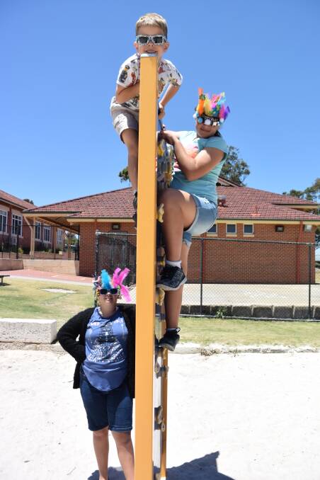 School adventure: Narsiah, Rory and Rahnui climbed up and down the play equipment on Friday, November 25. The Years One and Six students raised funds for the Fred Hollows Foundation. 