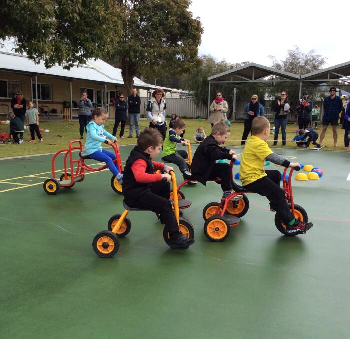 Wheels: Chase Smith, Flynn Darnell, Blake Digney and Quinn Roney racing through the cycling circuit, with the teachers and parents' support, at the Allanson Primary School Olympics. 