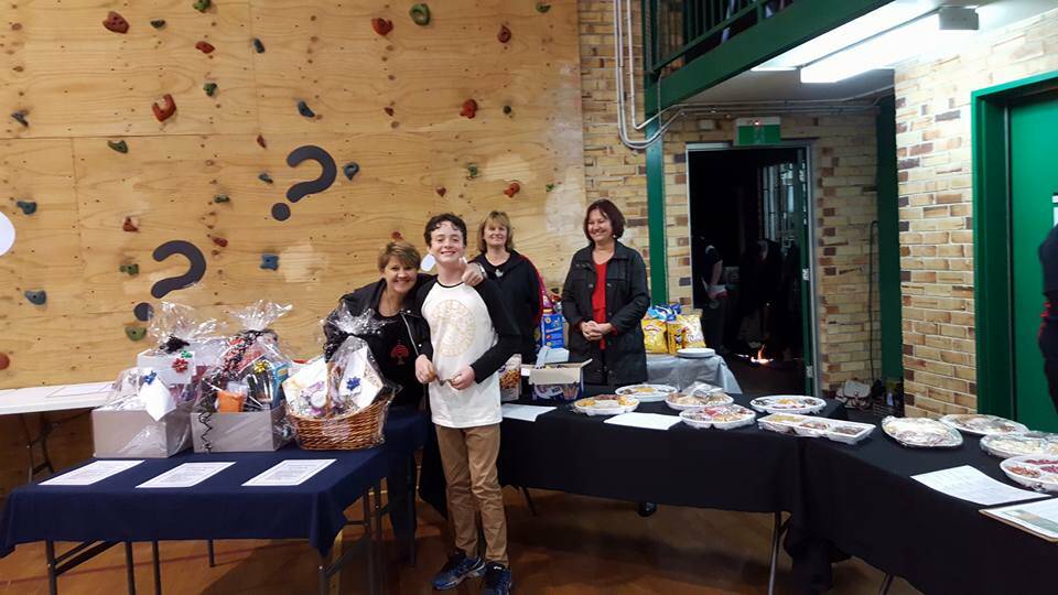 Fun Saturday night: Terri Watts, Will Cook, Jenny Leighton and Kelsey Simm helping otu at the Anzac tour group's quiz night earlier this month. Photo: Supplied. 