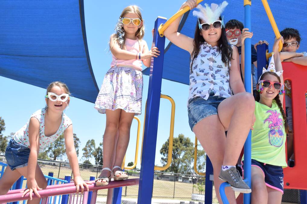 Climbing up: Kate, Jasmine, Dempsey and Chiara joined their classmates on the playground equipment throughout the day. 