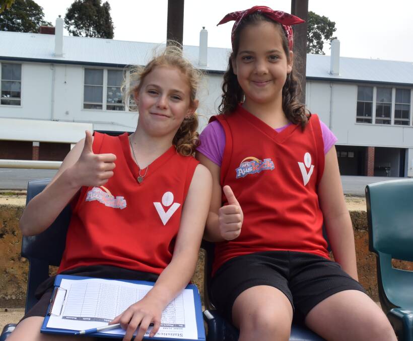 Cheer squad: Keeley Collier and Sky Moustafa took part in Amaroo's football activities, capping off term three shortly before the school holidays. 