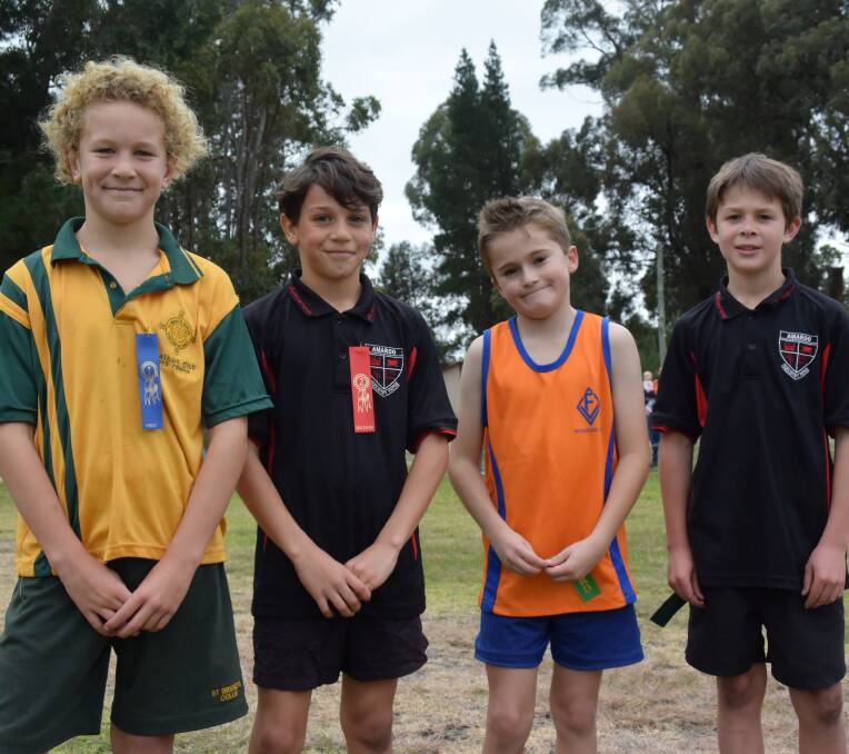 Tom Bell, Kalib Galbraith, Sam Kippin, and Max Ireland celebrated their positions on the podium after the Year 4 Boys 1500 metre race. 