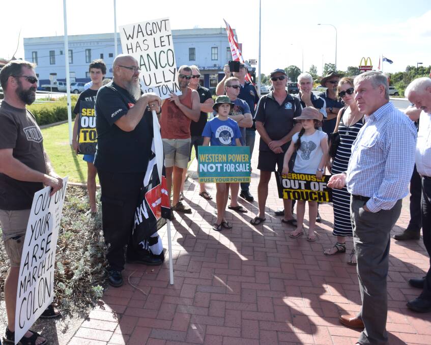 Community: WA Premier Colin Barnett talked with a protest group comprised of CFMEU, AMWU and Griffin community protest group members outside the Shire of Collie offices last week. Photo: Thomas Munday. 