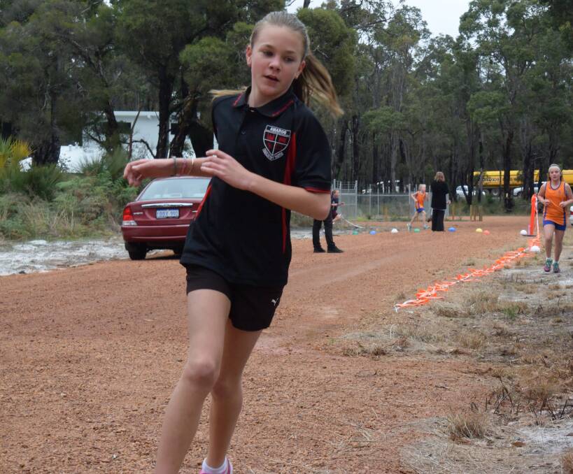Katy O'Brien raced along the cross country track, mastering both laps of the Year 4 Girls 1500m event in wintry conditions last week. 