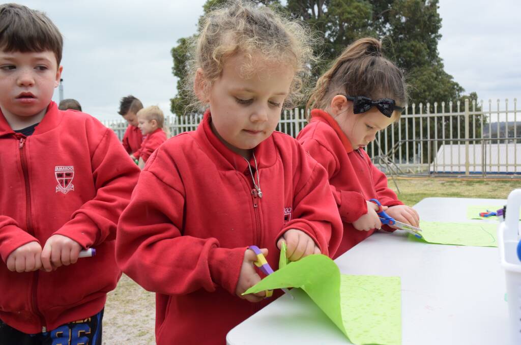 Amaroo activities: Annabelle Brown, Isabella Crowe and Patrick Duff had a blast throughout Kindy Three's day of outdoor adventures. 