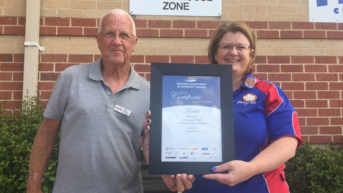 Recognition: Geoff Wilks and Linda Gallagher celebrate the PCYC's finalist award for the Communit TAB Community Service award.