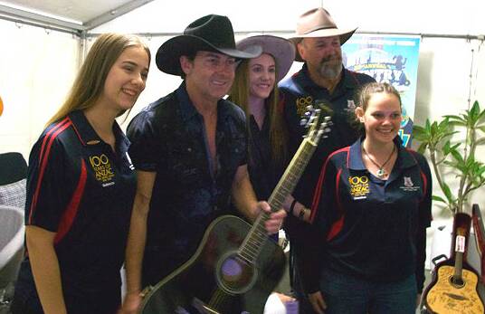 Star power: Students Rebecca Lockyear, Chloe Garner and Shanice Ryan with country music star Lee Kernaghan at the Boyup Brook Country Music Festival last weekend. 