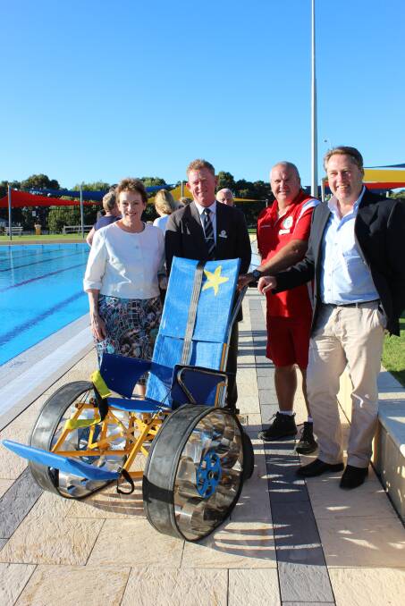 Making Collie accessible: Federal Assistant Minister for Social and Disability Services the Hon Jane Prentice MP, Cr Glyn Yates, pool manager Maurice Dhue and Federal MP for O'Connor Rick Wilson with wheelchair for access.