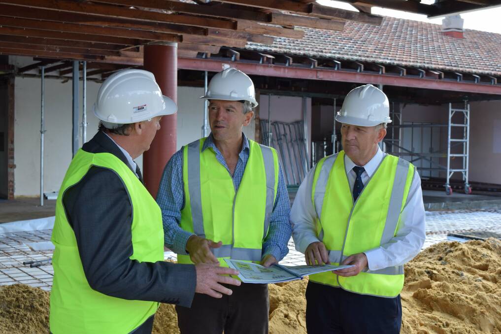 Future vision: Collie Shire President Wayne Sanford looks over the plans with Terry Redman and John Day. 