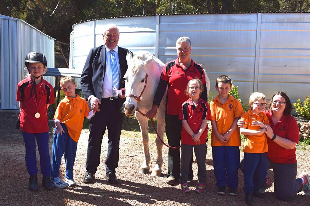 Grant for access: Member for Collie-Preston Mick Murray with RDA Collie manager Jo Williams and riding participants. Photo: Shannon Wood. 