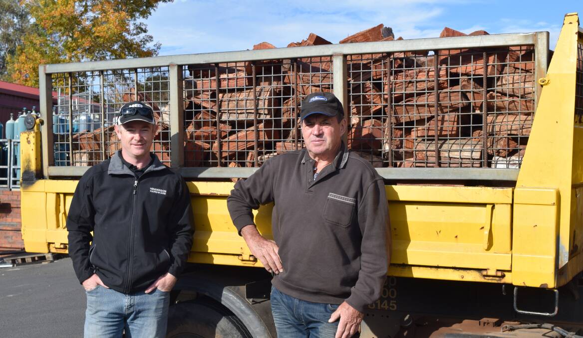 Fundraiser auction: CEFC President Ash Stewart and auction organsier Martin Coughlan ‘Irish’ with a load of firewood which is up for bids at the auction. Photo: Shannon Wood. 