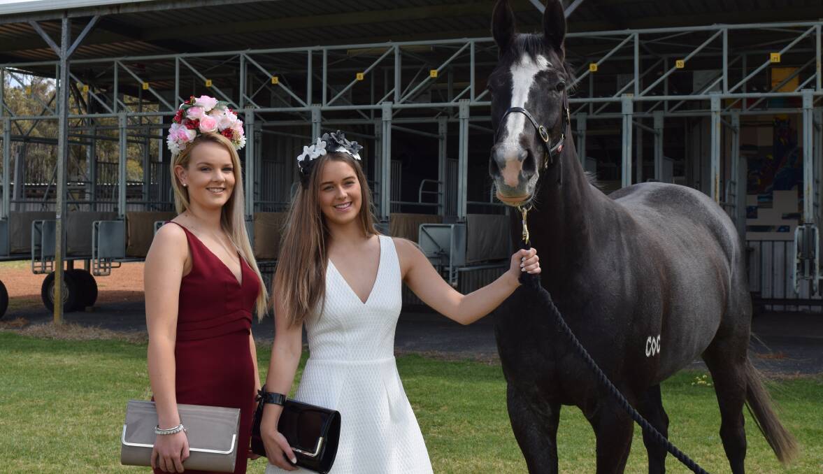 Fashions on the field: Casey Browne and Ashby Sanford are dressed to the nines  for the Collie Races in clothing and accessories from Toscas Boutique. Photo: Shannon Wood. 
