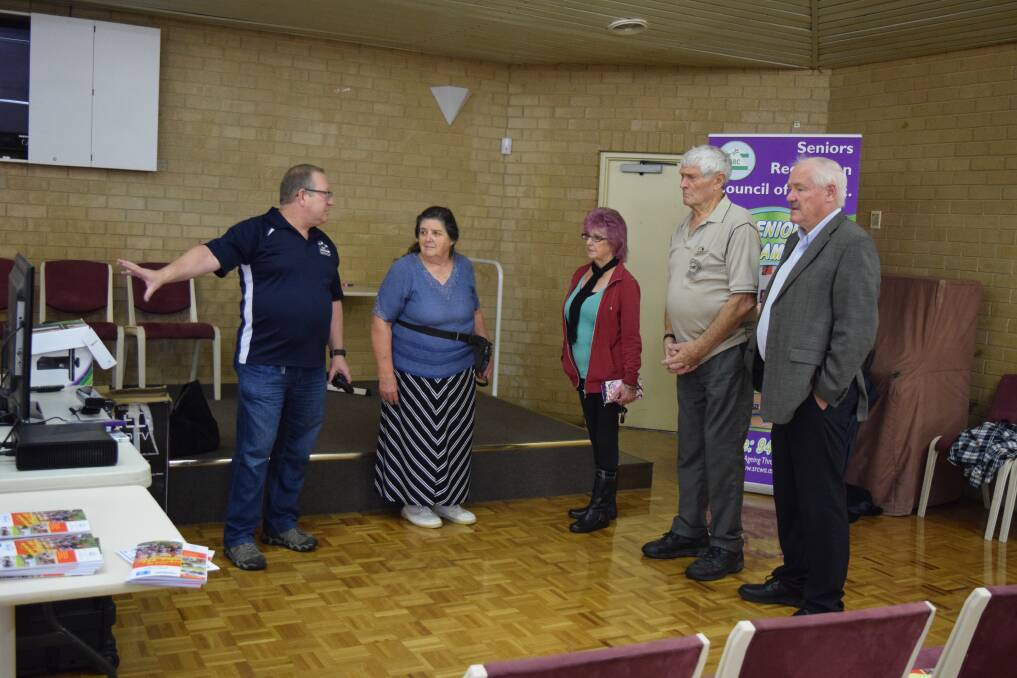 Game on: Seniors Exergaming WA Program Manager Martin Yates shows attendees the gaming system with Minister for Seniors and Ageing Mick Murray.