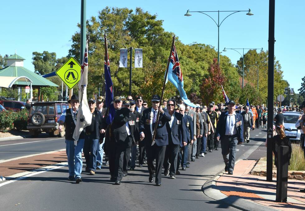 Marching proud: The Anzac Day parade made its way down Forrest Street before ending in Soldiers' Park for the commemorative service. Photo: Shannon Wood. 
