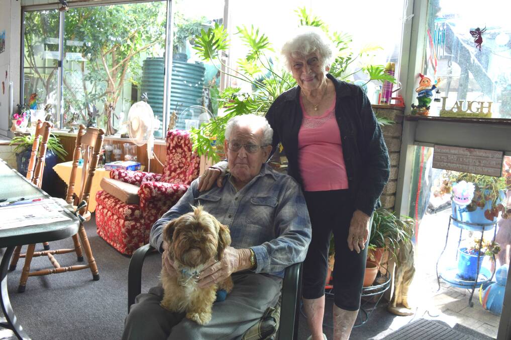 Diamond: Frank and Val Leadbitter at home with their dog Indy. The couple are celebrating their diamond anniversary. Photo: Shannon Wood. 