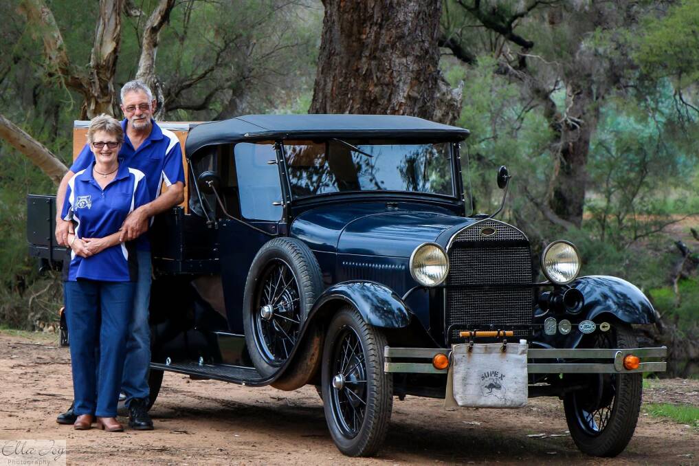 Driving for a good cause: Wayne and Anne Millman with their 1928 model A Ford ute. 