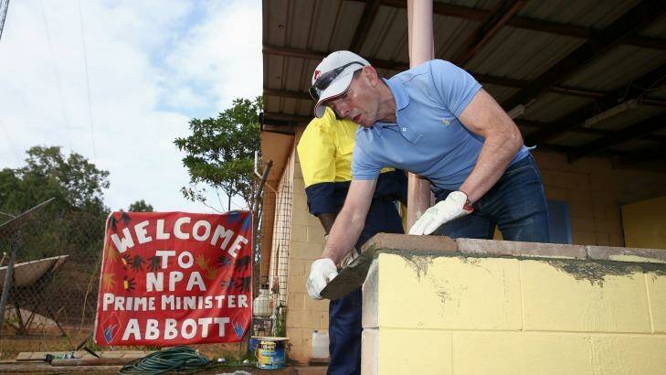 Prime Minister Tony Abbott assists in the community hall upgrade in the Injinoo community, Cape York.  Photo: Alex Ellinghausen