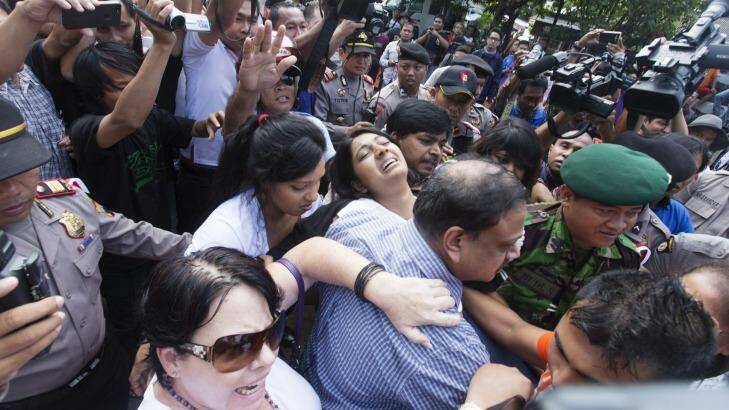 Indonesian authorities control the crowd around the relatives of the Bali nine pair at Wijaya Pura in Cilacap. Photo: James Brickwood