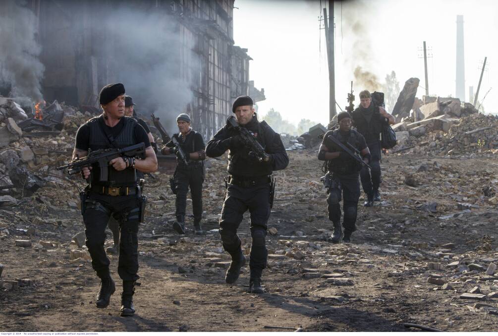 Action men: Sylvester Stallone, front, Jason Statham, centre, in a scene from Expendables 3.