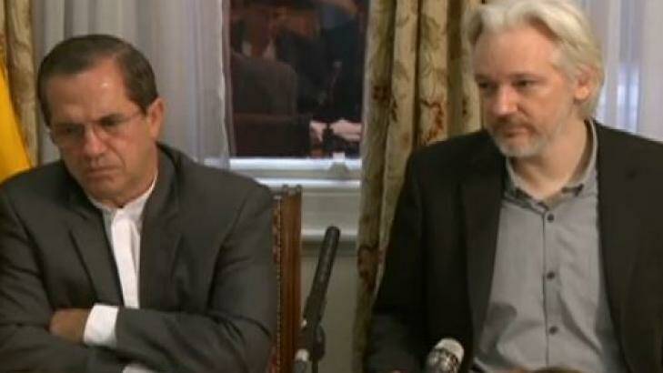 Julian Assange (right) speaks at a press conference with Ricardo Patino, Ecuador's Foreign Minister, in the Ecuadorian embassy in London on Monday.