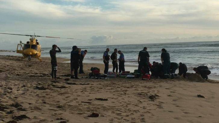 The scene at a Mandurah beach where a teenager is 'fighting for his life' following a shark attack. Photo: Marta Pascual Juanola