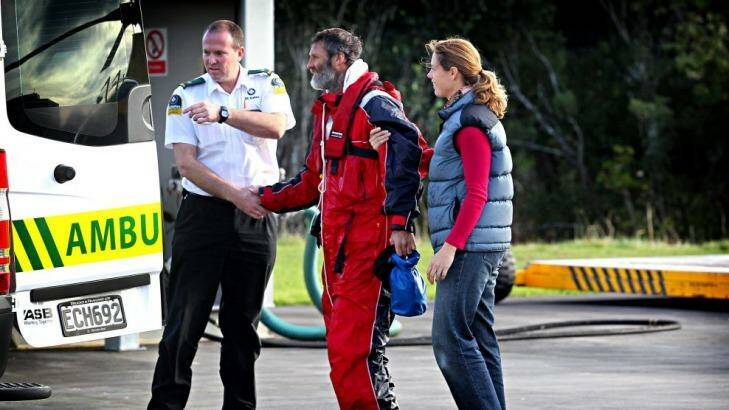 Cold comfort: Sarah Donaldson helps her husband Scott from the Taranaki Rescue Helicopter after he called it quits on his quest to kayak the Tasman Sea. Photo: Charlotte Curd