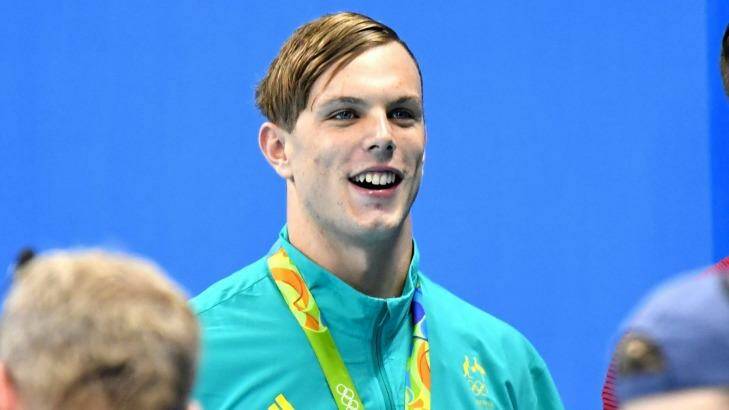 Kyle Chalmers with his gold medal for the men's 100m freestyle. Photo: Joe Armao