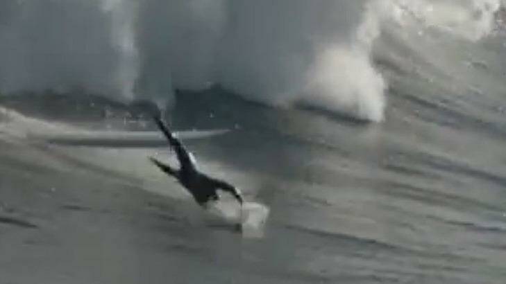 Another surfer is sent flying from his board as he tackles a huge wave Photo: www.mysurf.tv