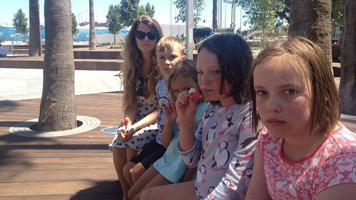 This Cottesloe family was unimpressed to find a bone-dry Elizabeth Quay water park earlier in the year. Photo: Ray Sparvell 
