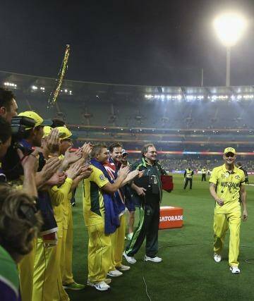 The Australian team form a guard of honour for Michael Clarke as he leaves the field after Sunday's World Cup final at the MCG.   Photo: Ryan Pierse