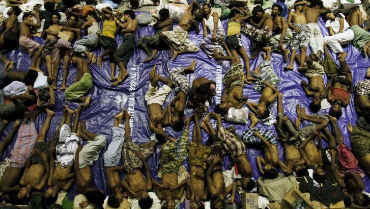 Nearly 600 migrants thought to be Rohingya refugees from Myanmar were rescued from two wooden boats stranded off the coast of Indonesia's northern Aceh province on Sunday.  Photo: Ronu Bintang