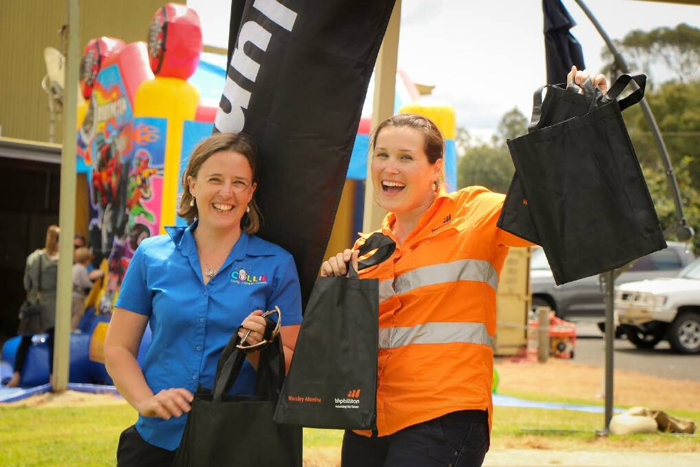 Good times: Pamela Peters of CEYN Co-ordinated and Jenelle Bowles of BHP Billiton Worsley Alumina have a blast at the Family Fun Day.