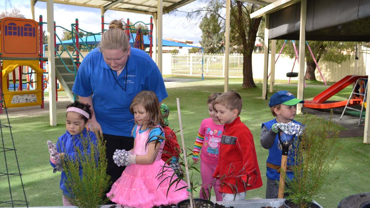 Harmony Pakoti, Kimbalee Wright, Lucy Swan, Thomas Whitney and Jacob Fraser follow Elisha Fraser's directions during National Tree Day organised by Collie Shire Council