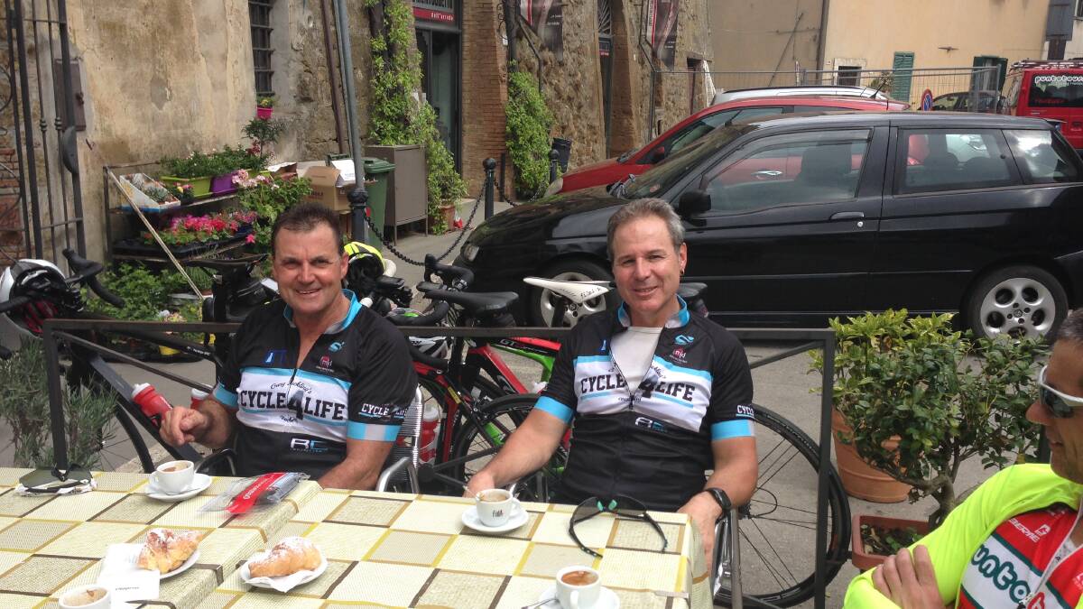 Break time: Steve DeAngelis and Mark Paget stop for coffee in a Tuscan village.