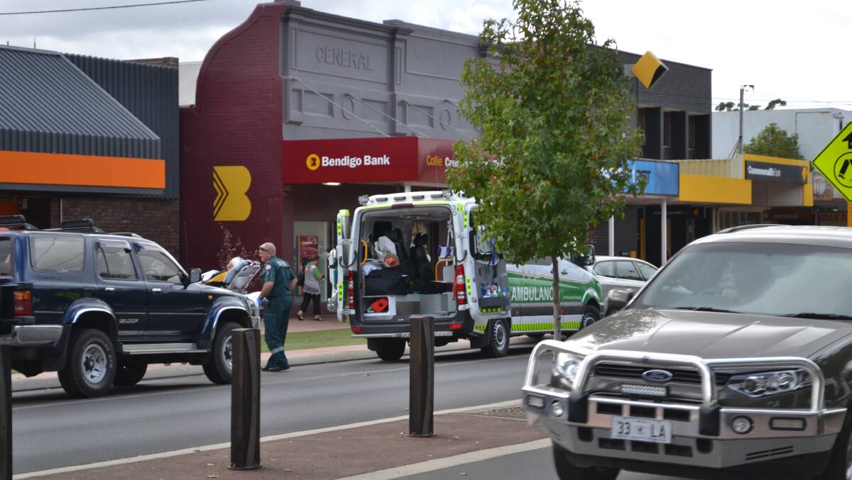 A man is taken away in an ambulance following a fight in Collie's main street. 