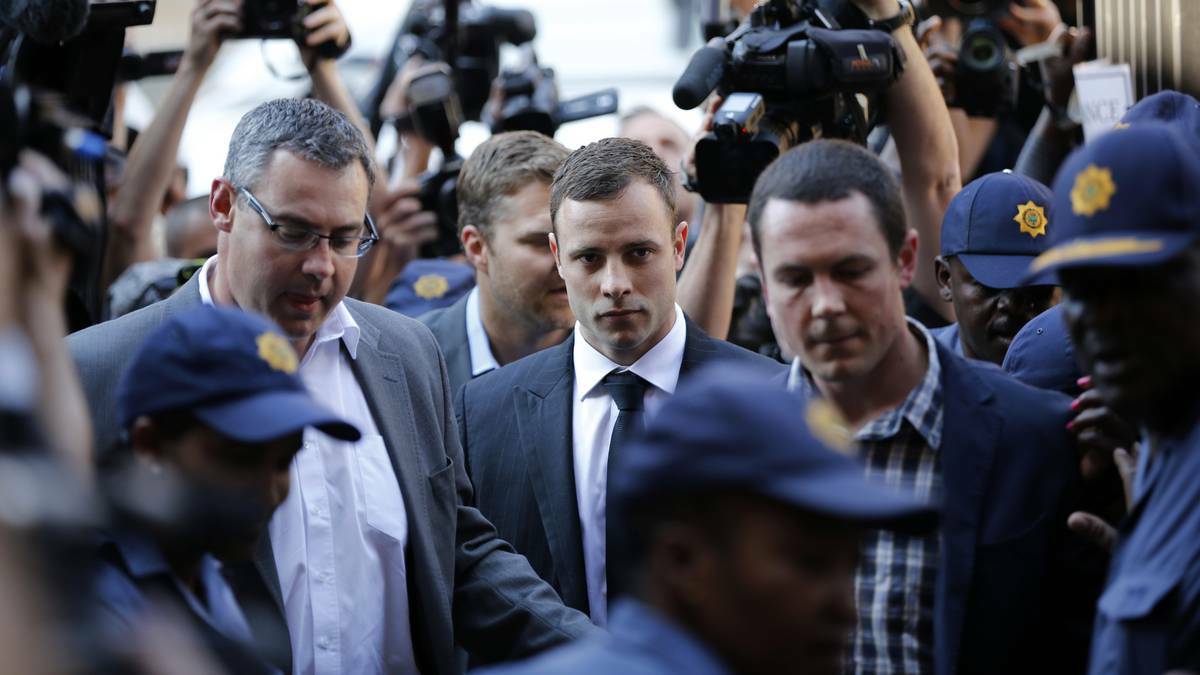 South African Olympic and Paralympic track star Oscar Pistorius (C) arrives for the verdict in his murder trial at the high court in Pretoria September 11, 2014. Photo: Reuters.