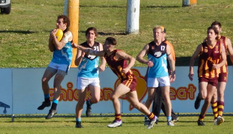 Leading the pack: Kyle Shanahan takes the mark, backed up by team mates Jebb Swallow and team captain Matt Blackford. Photo: Supplied.