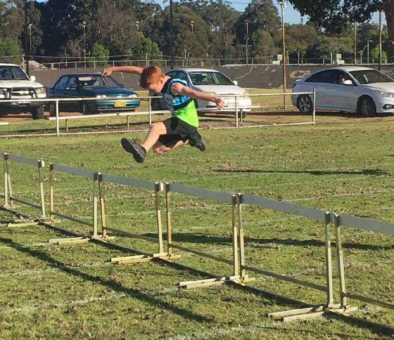 Under 11s: Corbin Marley running in a hurdles event. Photo: supplied.