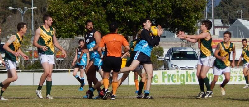 Reserves: Quinten Hill in the pack as Nathan Cleggett takes the mark.