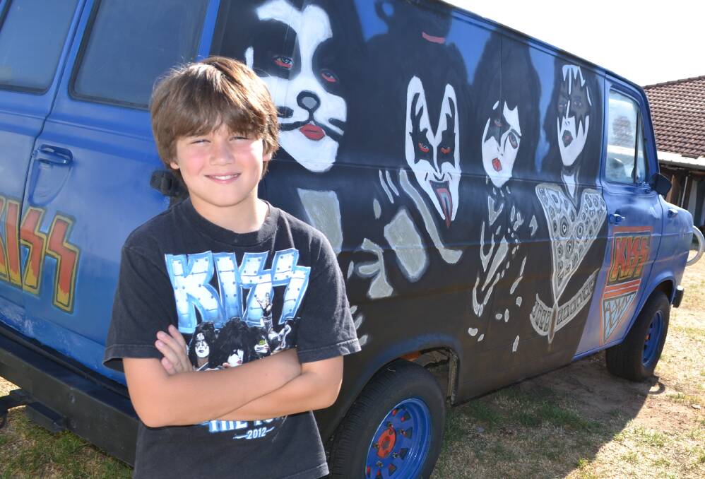 Kiss wheels: Ten year old Sage Mileto with the "Kiss van" he and his family will drive to Perth to watch Kiss tonight.