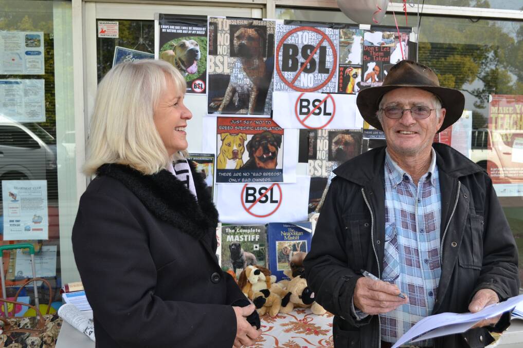 Community support: Dianne Murray organised a rally on Saturday opposing breed-specific legislation. Dog owner Peter Ferguson signed the petition to oppose the law changes.