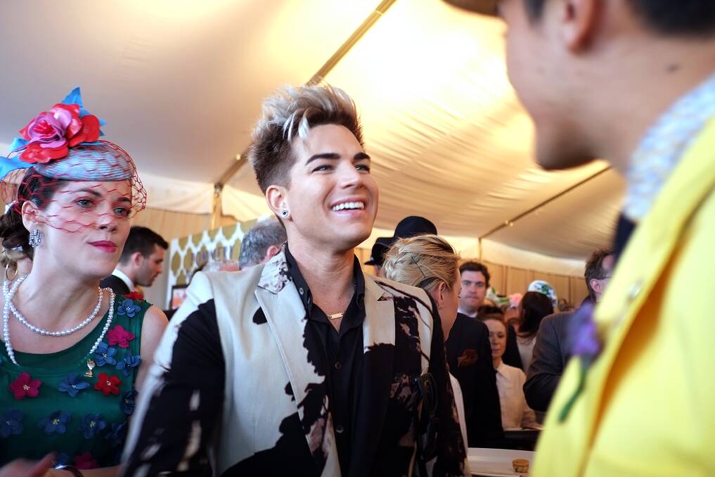 Photo of singer Hetty Kate and Evan Spargo meeting up with Adam Lambert at the Beck Caulfield Guineas Day on Saturday October 13, 2012. The Sunday Age/Luis Enrigue Ascui