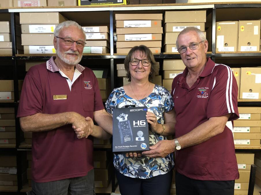 Veteran Car Club of WA inc., Collie branch members Tony Edwards and Hamish Pipe with Collie Public Library representative Tania Roberts. 