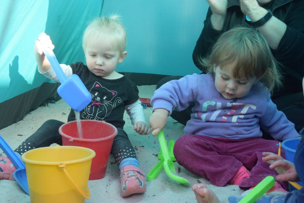Working together: Freya and Lily enjoyed the tent and outdoor play area during their time at Collie Early Education Centre. 
