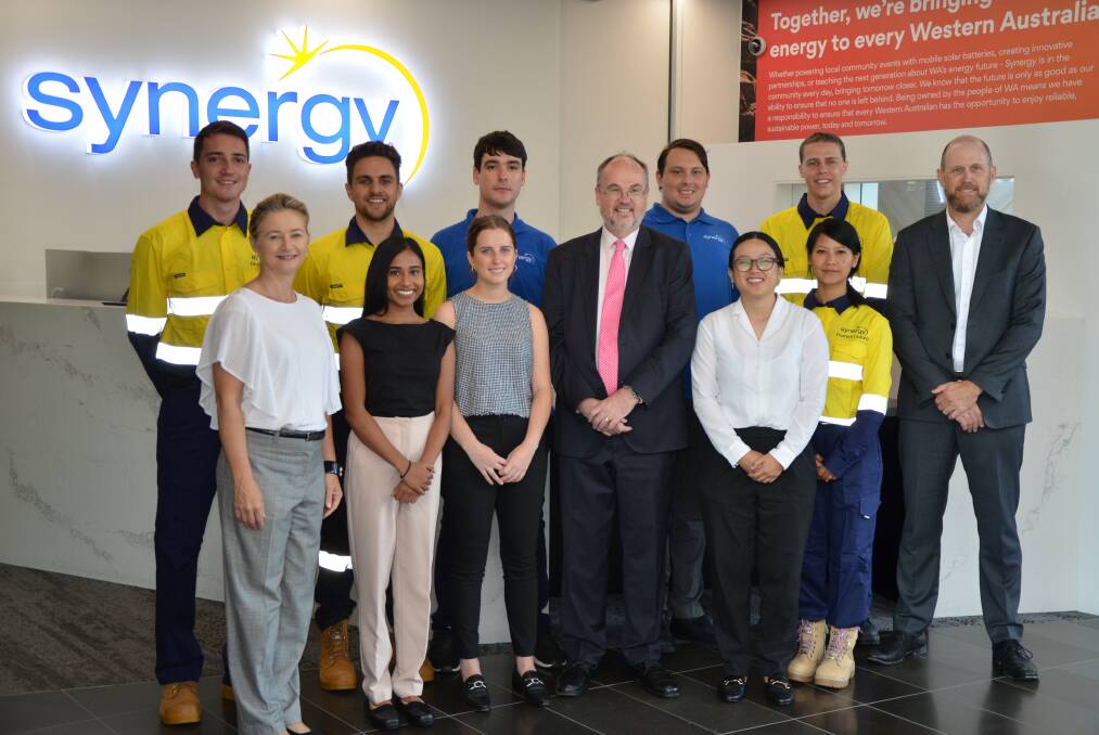 Happy together: Synergy general manager sustainability Angie Young, Energy Minister Bill Johnston, and Synergy chief executive Jason Waters with Synergy's nine new graduates. Photo: Supplied. 