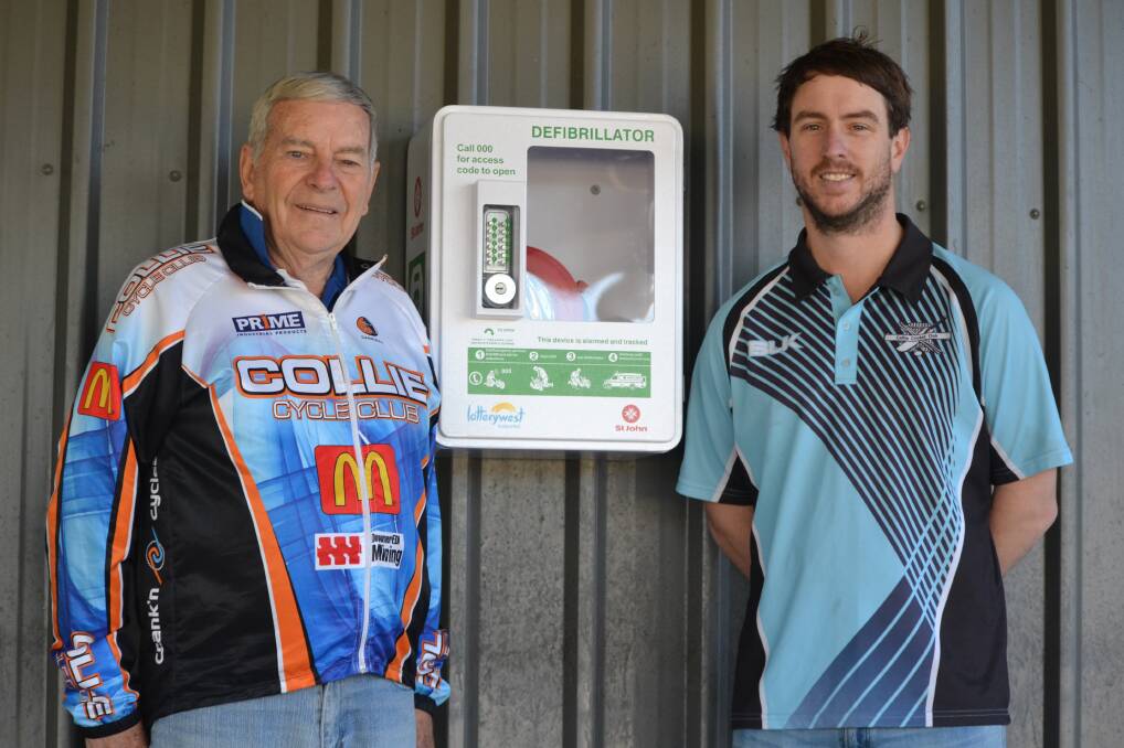 Over the moon: Collie Cycle Club president Alf Mason and Collie Cricket Club secretary Mark Williams next to one of the new defibrillators. Photo: Collie Mail. 