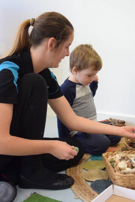 Adventure time: Erin and Atrell looked at all manner of leaves, rocks, sticks and pieces of bark during the Collie Early Education Centre's nature play solutions extravaganza on Tuesday. 